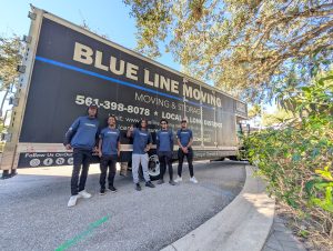 Blue Line Moving & Storage team standing in front of branded moving truck in South Florida, professional Boca Raton movers ready for local and long-distance relocation.